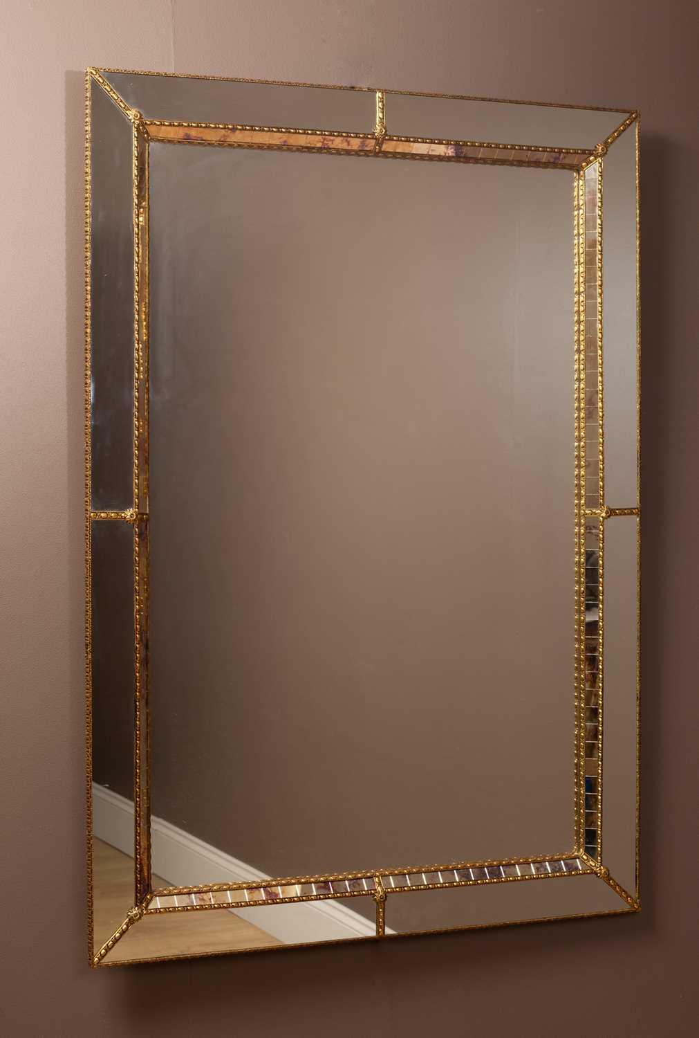 Lot 250 - A brass framed mirror