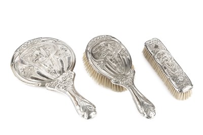 Lot 726 - An Edwardian silver backed three piece...