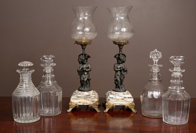 Lot 118 - A pair of bronze and glass table lamps together with four cut glass decanters