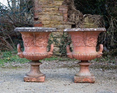 Lot 1277 - A pair of terrracotta coloured cast reconstituted stone campana urns