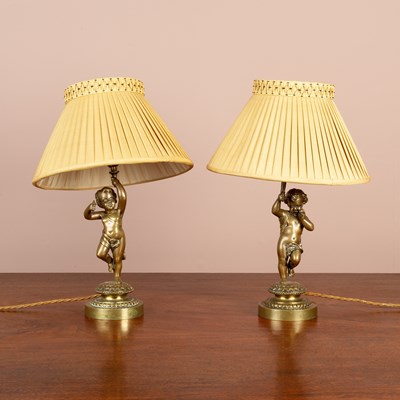 Lot 128 - A pair of Victorian cast brass table lamps