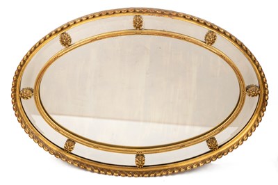 Lot 144 - A decorative gilt oval mirror in the Georgian style