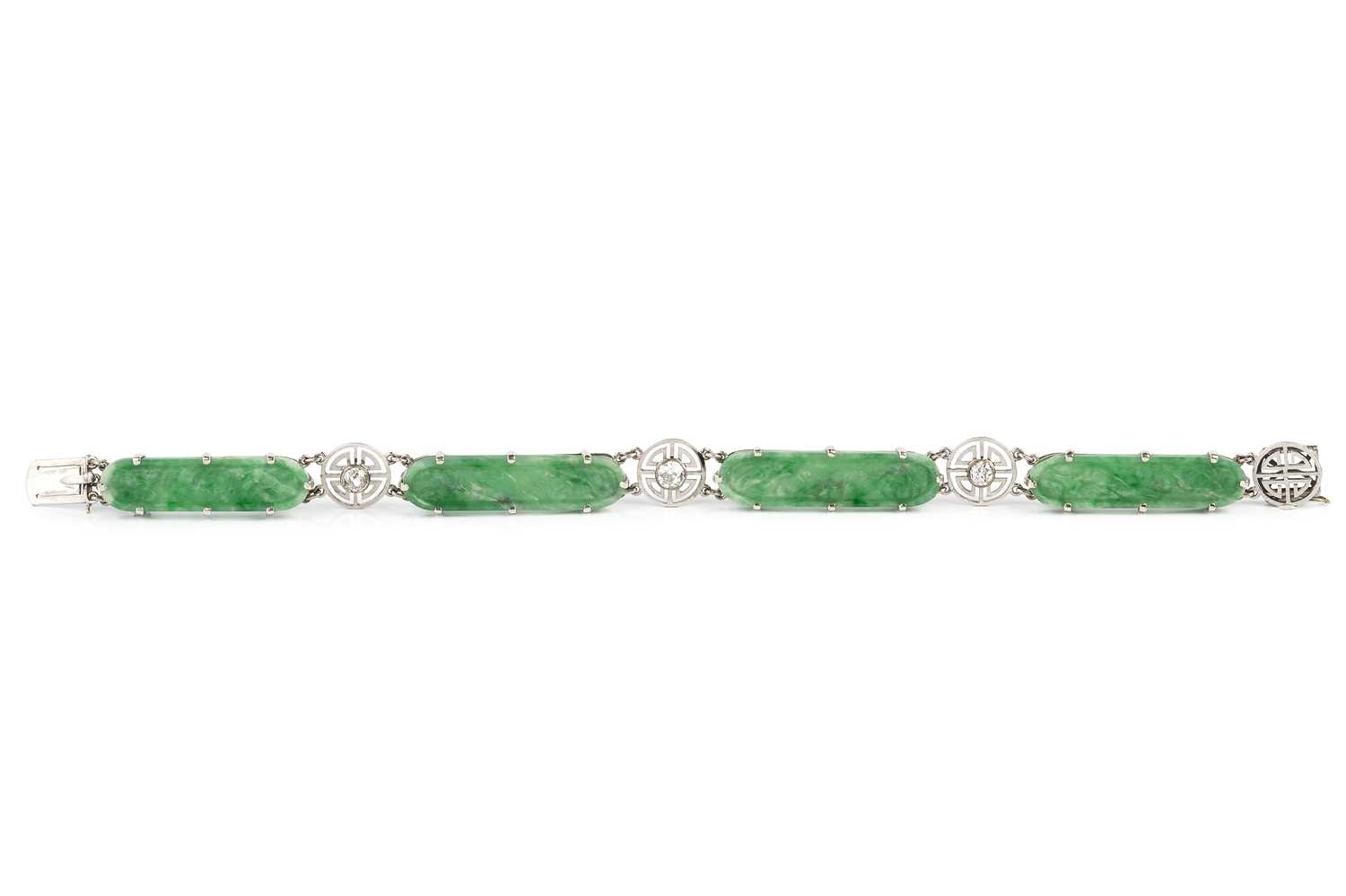 Lot 166 - An Art Deco jade and diamond panel bracelet,...