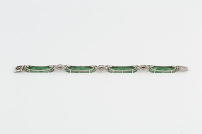 Lot 166 - An Art Deco jade and diamond panel bracelet,...