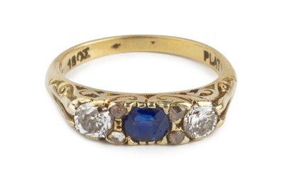 Lot 199 - A sapphire and diamond half hoop ring, centred...