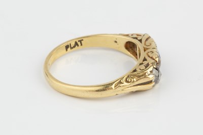 Lot 199 - A sapphire and diamond half hoop ring, centred...