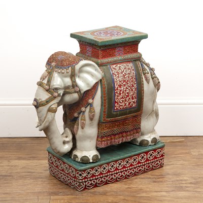 Lot 340 - Pottery elephant on stand the elephant cream...