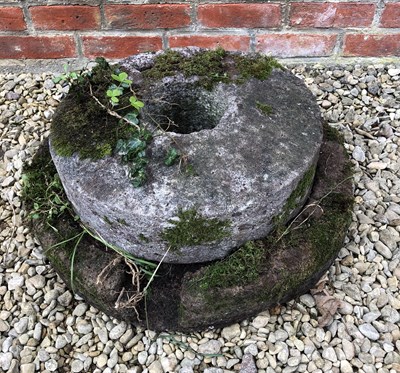 Lot 530 - A grain grinding stone quern