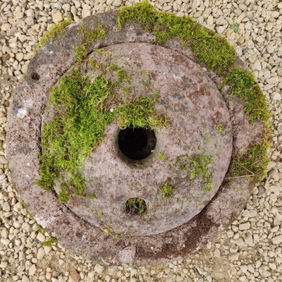 Lot 501 - A carved stone grinding quern