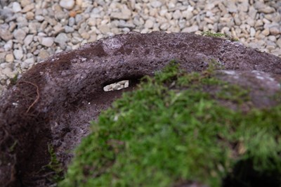 Lot 501 - A carved stone grinding quern