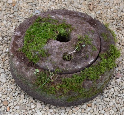 Lot 501 - A carved stone grinding quern