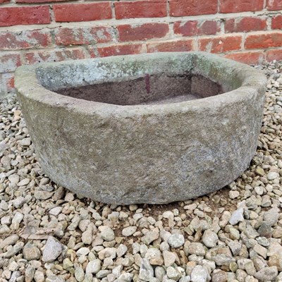 Lot 500 - An old D-shaped stone trough