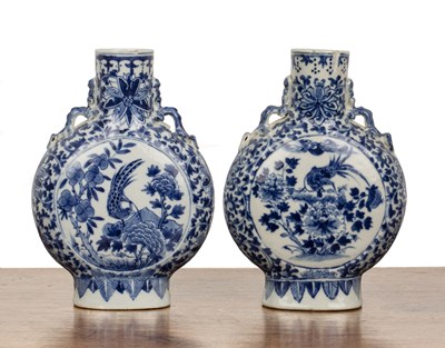 Lot 31 - Pair of small blue and white moonflasks...