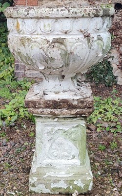 Lot 564 - A white painted cast reconstituted stone garden urn