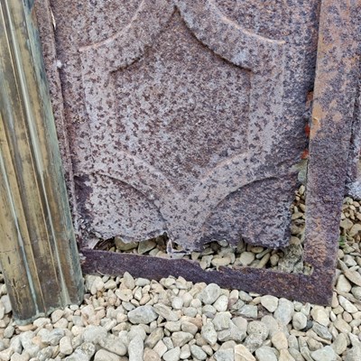 Lot 590 - A Cast Iron Fireplace Insert with a brass fire surround