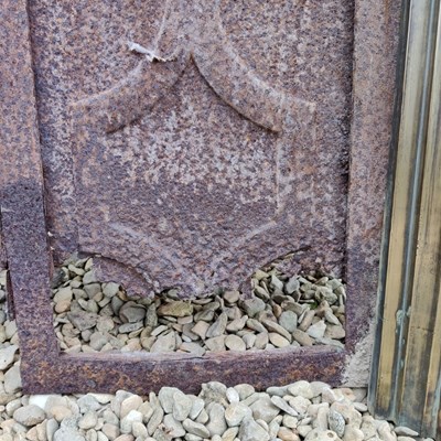 Lot 590 - A Cast Iron Fireplace Insert with a brass fire surround