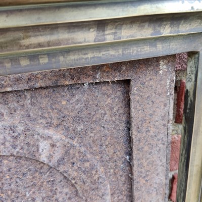 Lot 590 - A Cast Iron Fireplace Insert with a brass fire surround
