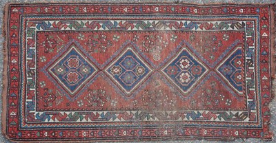 Lot 109 - An early-20th century hand knotted Kazak style rug