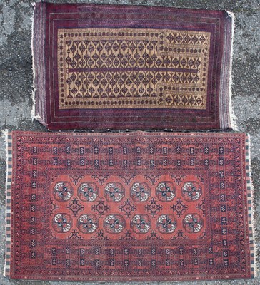 Lot 364 - A modern machine made Baluchi rug together with a handwoven Afghan style prayer rug