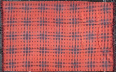 Lot 395 - A modern woven rug with a red ground