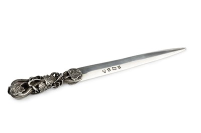 Lot 523 - A silver letter opener, the shaped handle...