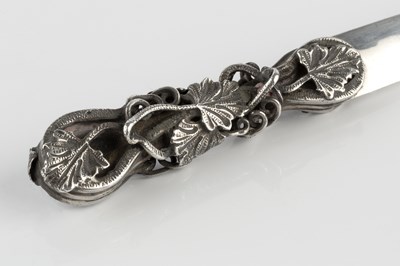 Lot 523 - A silver letter opener, the shaped handle...