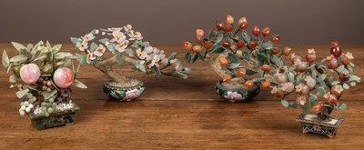 Lot 270 - A group of four Chinese hardstone tree ornaments in the form of bonsai trees