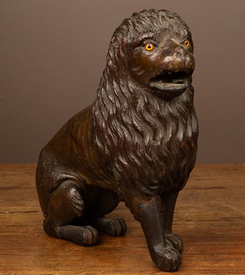 Lot 226 - An antique carved hardwood sculpture of a lion