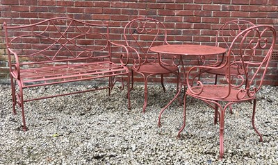 Lot 562 - A red painted garden furniture