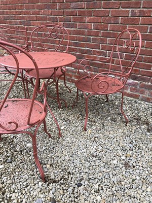 Lot 562 - A red painted garden furniture