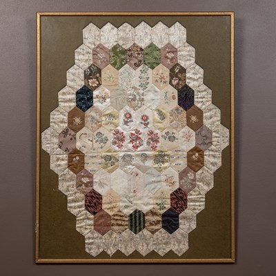 Lot 228 - An antique silk patchwork quilt section