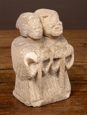 Lot 563 - A small carved limestone sculpture