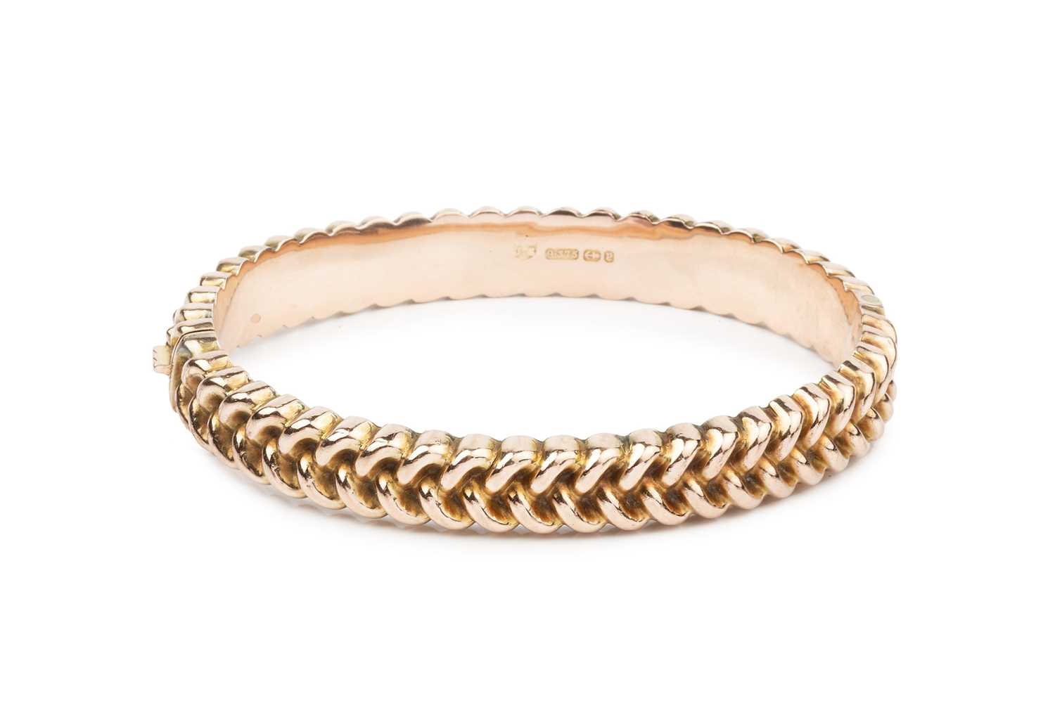 Lot 30 - A Victorian 9ct rose gold hinged bangle, with...