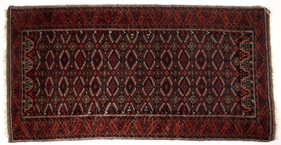 Lot 335 - An early 20th century Balouch red ground rug...