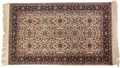 Lot 333 - A 20th century Middle Eastern cream ground rug...