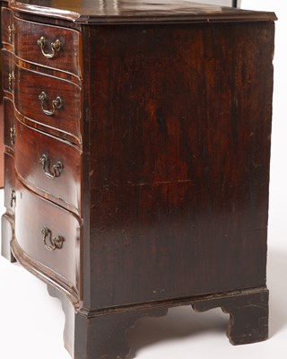 Lot 9 - A George III mahogany serpentine chest of four...