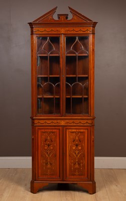 Lot 113 - An Edwardian mahogany marquetry decorated corner cupboard