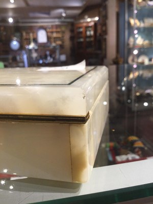 Lot 124 - An English Art Deco onyx box with green stone...