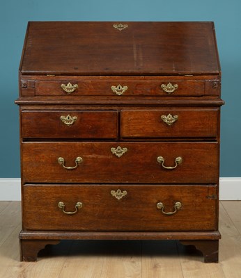 Lot 453 - An old oak bureau