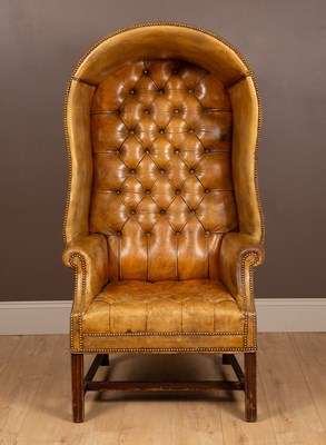 Lot 527 - A leather and hardwood button-back porters chair