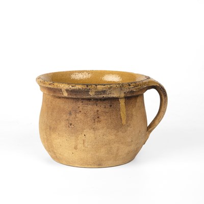 Lot 54 - A antique post medieval jug with straw glaze,...