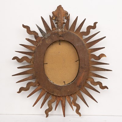 Lot 65 - An antique Spanish gilt sunburst wall mirror...