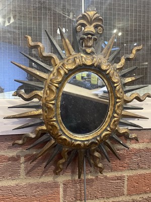 Lot 65 - An antique Spanish gilt sunburst wall mirror...