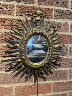 Lot 65 - An antique Spanish gilt sunburst wall mirror...