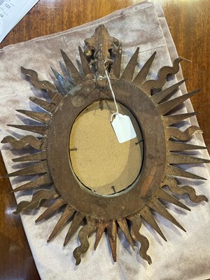 Lot 65 - An antique Spanish gilt sunburst wall mirror...