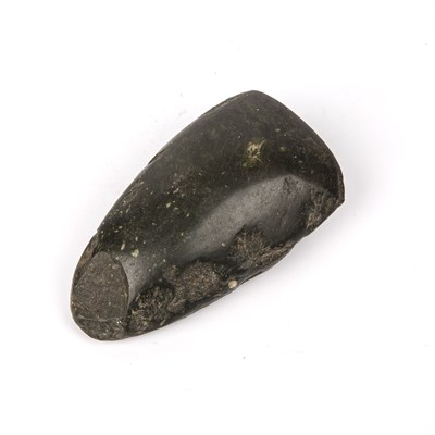 Lot 354 - An antique carved stone axe head 6cm x 11.5cm...