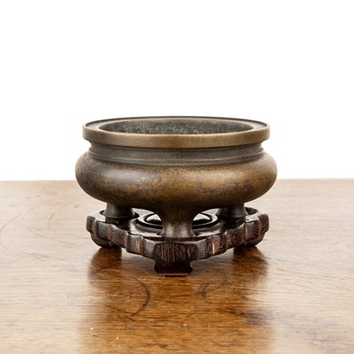 Lot 166 - Bronze censer on a hardwood stand Chinese,...