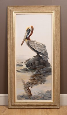 Lot 163 - Mario Fernandez (1946-2012), a pelican standing on a rock