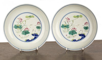 Lot 147 - Pair of white ground porcelain Doucai shallow...