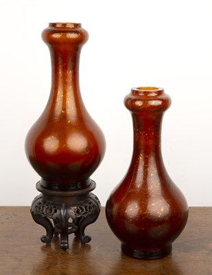 Lot 141 - Pair of Peking amber glass tulip neck vases...